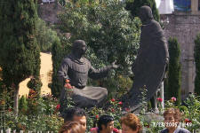 Statue of Juan Diego showing cloak to church official